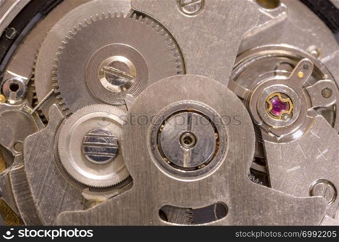 Macro shot of clockwork gears inside the old watch