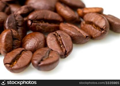 macro shot of coffee beans isolated on white background