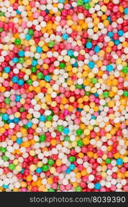 Macro shot of colorful sugar balls for texture and background