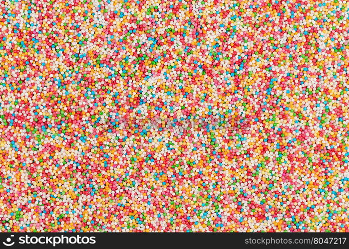 Macro shot of colorful sugar balls for texture and background