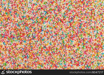 Macro shot of colorful sugar balls for texture and background