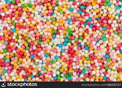 Macro shot of colorful sugar balls for texture and background