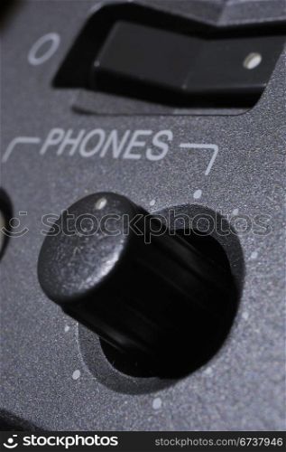 "Macro shot of the "Phones" button."