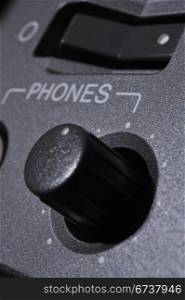 "Macro shot of the "Phones" button."