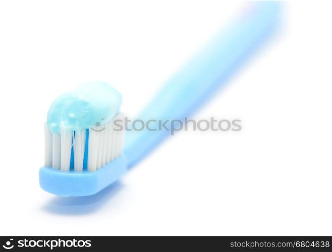 Macro shot of toothbrush on the white background.