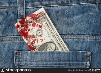 Macro shot of trendy jeans with american 1 dollar bill on its pocket, blood