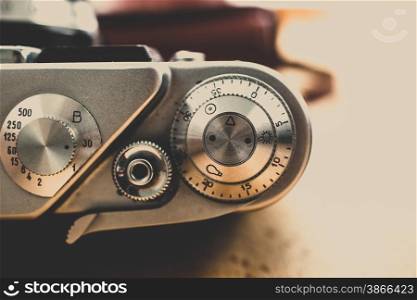 Macro toned shot of metal buttons and controls on vintage film camera