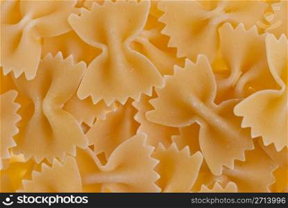 Macro up view of yellow macaroni background.