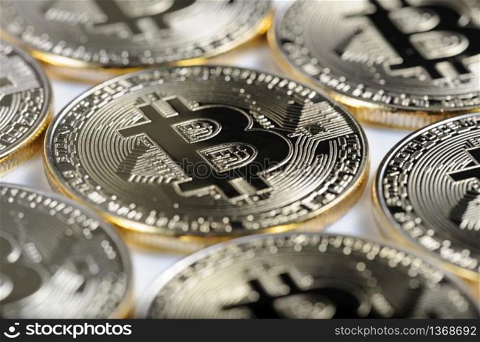 Macro view of shiny Bitcoin souvenire coins as background, selective focus. Macro view of shiny Bitcoin souvenire coins