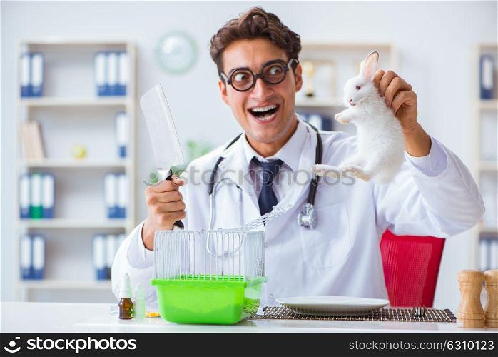 Mad crazy doctor preparing to eat rabbit