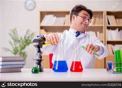 Mad crazy scientist doctor doing experiments in a laboratory