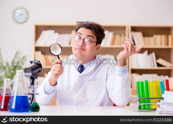 Mad crazy scientist doctor doing experiments in a laboratory