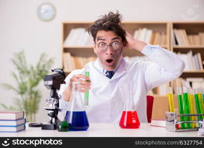 Mad crazy scientist doctor doing experiments in a laboratory