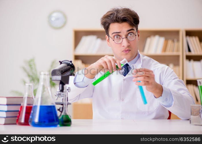 Mad crazy scientist doctor doing experiments in a laboratory