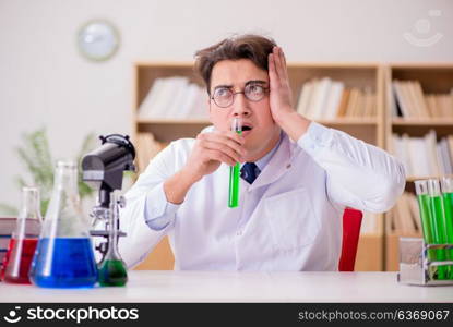 Mad crazy scientist doctor doing experiments in a laboratory