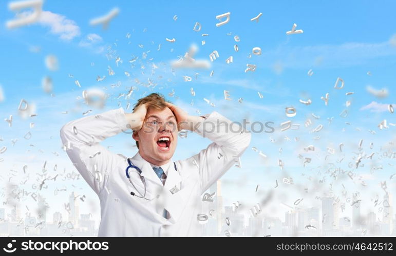Mad doctor. Young frustrated crazy doctor screaming very emotionally