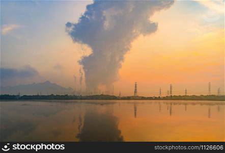 Mae Moh Coal Power Plant with smoke and toxic air from chimney. Factory industry. Electricity tower in energy or pollution environment concept. Lampang City, Thailand