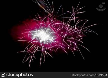 Magenta Horizontal Sparkling Fireworks Background on Night Scene. Abstract color fireworks background and smoke on sky