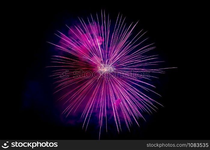 Magenta Sparkling Fireworks Background on Night Scene. Abstract color fireworks background and smoke on sky
