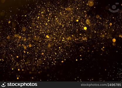 Magic glowing gold dust particles flowing abstract background 