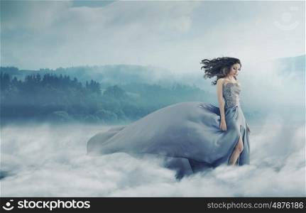 Magical brunette lady on the foggy field