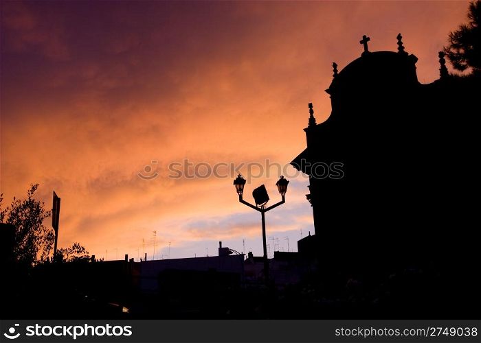 Magical church silhouette during the sunset in south of Italy