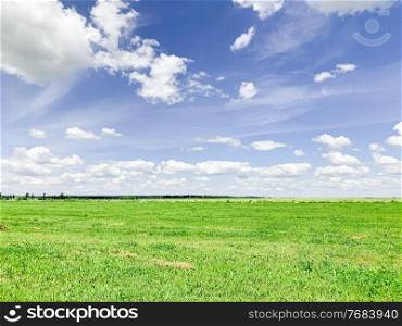 Magical deep aerial white clouds on blue sky, green field.. Magical deep aerial white clouds on blue sky and green field.