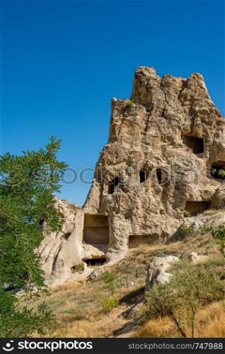Magical fairy chimneys in the canyon near in Goreme, Cappadocia, Nevsehir Province in the Central Anatolia Region of Turkey