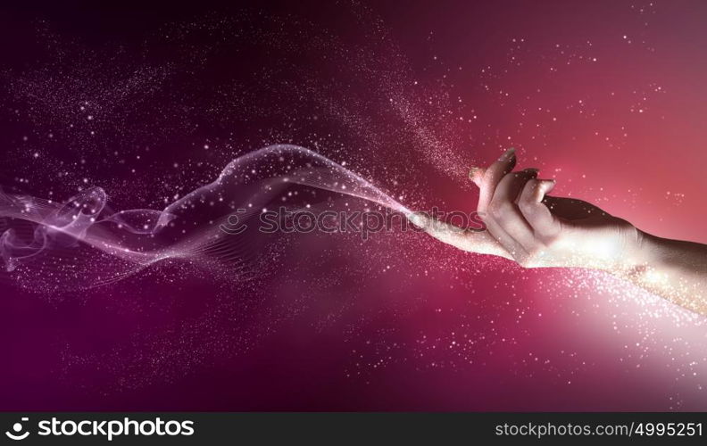 magical hands conceptual image. magical hand conceptual image with sparkles on colour background