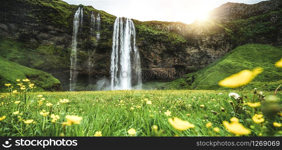 Magical Seljalandsfoss Waterfall in Iceland. It is located near ring road of South Iceland. Majestic and picturesque, it is one of the most photographed breathtaking place of Iceland.