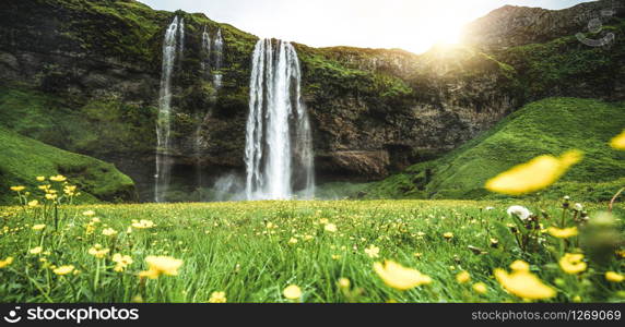 Magical Seljalandsfoss Waterfall in Iceland. It is located near ring road of South Iceland. Majestic and picturesque, it is one of the most photographed breathtaking place of Iceland.