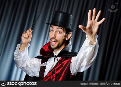 Magician doing tricks in dark room