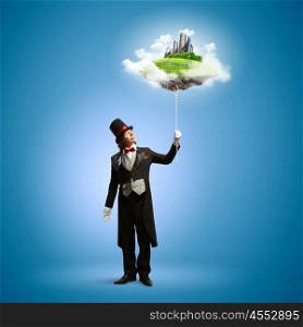 Magician with globe. Image of magician in hat holding globe. Ecology concept
