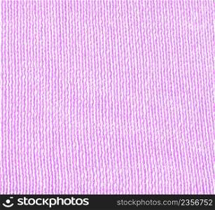 Magneta knitted background with copy space. Fabric purple lavender colored colored texture for background and design.