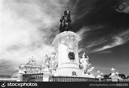 Magnificent bronze statue of King Joseph I of Portugal on top of a monumental plinth in the center of the imposing Praca do Comercio in Lisbon, Portugal
