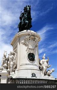 Magnificent bronze statue of King Joseph I of Portugal on top of a monumental plinth in the center of the imposing Praca do Comercio in Lisbon, Portugal
