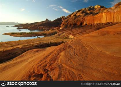 Magnificent red sandstone formations along the shores of Lake Powell, Arizona, United States.