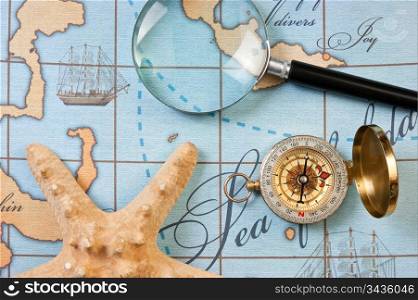magnifier and compass on a stylized map