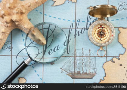 magnifier and compass on a stylized map