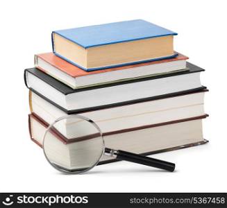 Magnifying glass and books stack isolated on white