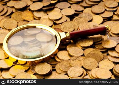 Magnifying glass and coins at the background