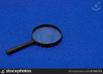 Magnifying glass isolated on a blue background