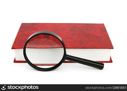 Magnifying glass over the stack of books