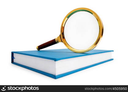 Magnifying glass over the stack of books