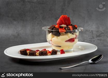 Magnolia pudding dessert with strawberries and cream
