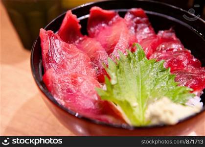 Maguro don fresh raw Tuna sashimi rice bowl Japanese famouse cuisine close up detail