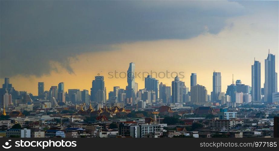 Mahanakhon and Temple of the Emerald Buddha, Grand palace, Wat Pho, and skyscraper buildings. Bangkok City in downtown area at sunset, Thailand. Buddhist temple.