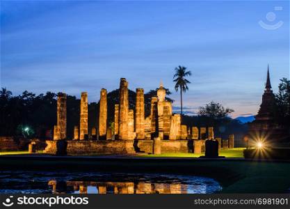 Mahathat temple in twilight time with blue sky background at Sukhothai Historical Park Thailand,famous tourist attraction in northern Thailand.Tourism industry concept.Traveling in Asia.