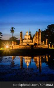 Mahathat temple in twilight time with blue sky background at Sukhothai Historical Park Thailand,famous tourist attraction in northern Thailand.Tourism industry concept.Traveling in Asia.