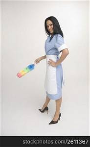Maid holding feather duster